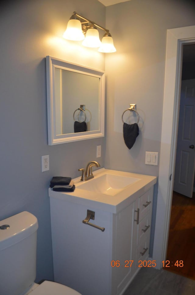 403 Hoover Ave, Benton Harbor, MI 49022 - bathroom featuring vanity and toilet
