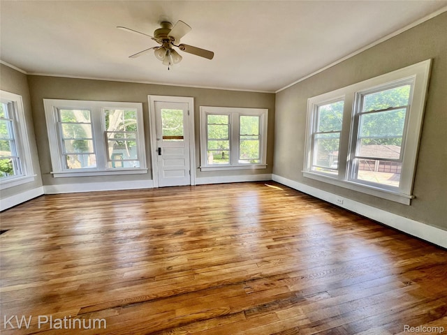 2109 Military St, Port Huron, MI 48060 - spare room with crown molding, wood finished floors, and ceiling fan