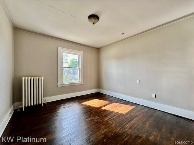 2109 Military St, Port Huron, MI 48060 - empty room with radiator heating unit, ornamental molding, and wood finished floors
