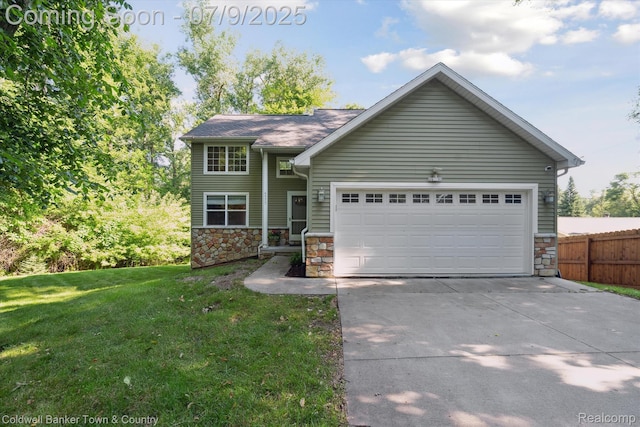 4577 Oaklawn Dr, Pinckney, MI 48169 - view of front of property with stone siding, concrete driveway, and a garage