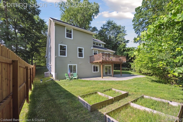4577 Oaklawn Dr, Pinckney, MI 48169 - rear view of property featuring a patio area, a garden, and a deck