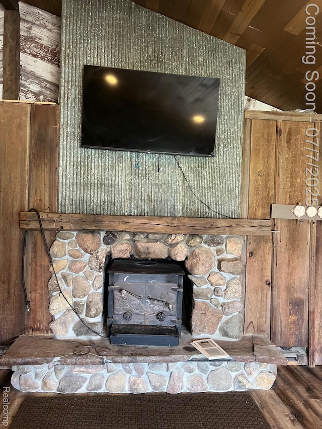 3500 Schlaud Rd, North Branch, MI 48461 - detailed view of wood ceiling, wood finished floors, a wood stove, and wood walls