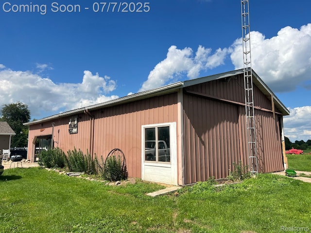 3500 Schlaud Rd, North Branch, MI 48461 - view of side of home featuring a pole building, a lawn, and an outdoor structure
