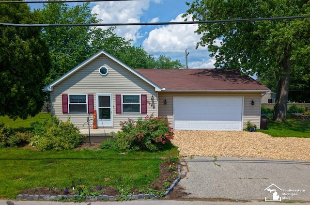 5985 Shady Ln, Newport, MI 48166 - ranch-style house featuring driveway, a garage, and a front yard