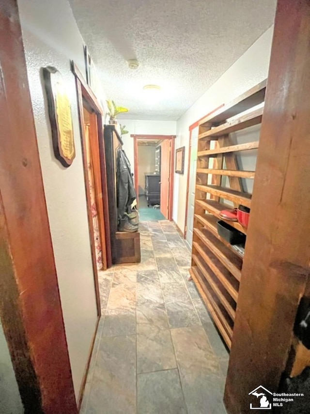 5985 Shady Ln, Newport, MI 48166 - hall featuring light stone finish floors and a textured ceiling
