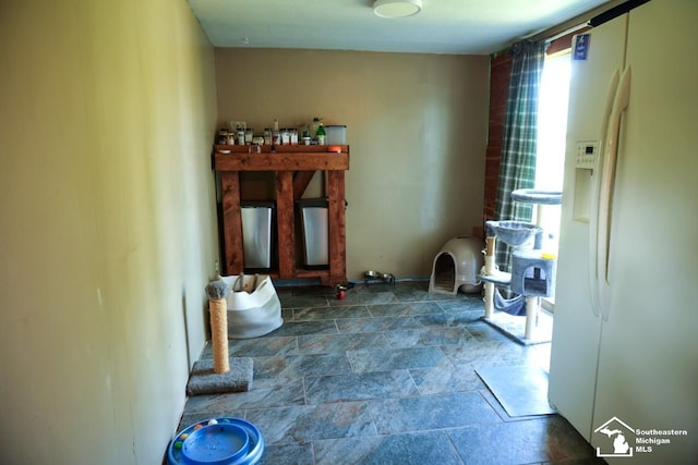 5985 Shady Ln, Newport, MI 48166 - laundry room featuring stone finish flooring