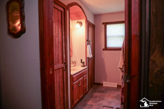 5985 Shady Ln, Newport, MI 48166 - bathroom with vanity and baseboards
