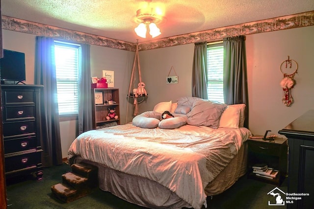 5985 Shady Ln, Newport, MI 48166 - bedroom with a textured ceiling, carpet, and a ceiling fan