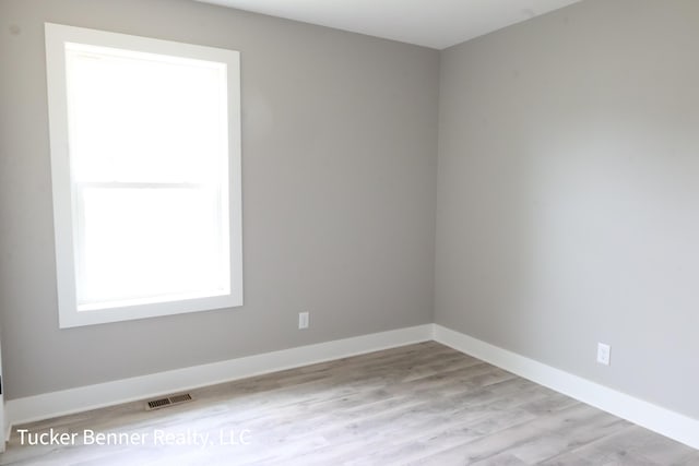 518 S Sullivan Ave, Fremont, MI 49412 - empty room with wood finished floors and baseboards