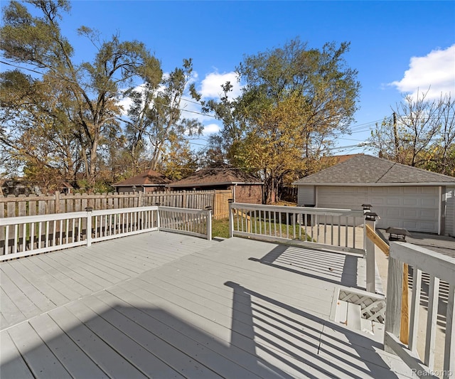 16554 Muirland St, Detroit, MI 48221 - deck with a detached garage, an outbuilding, and a fenced backyard