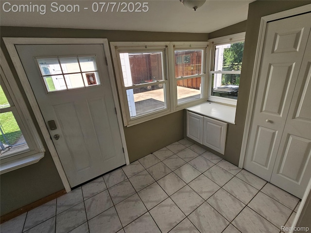 53120 Odilon Ave, Shelby Twp, MI 48316 - foyer with healthy amount of natural light and light tile patterned floors