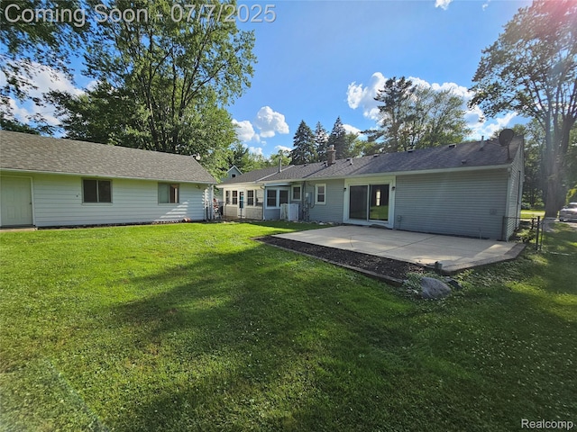 53120 Odilon Ave, Shelby Twp, MI 48316 - rear view of property featuring a patio and a lawn