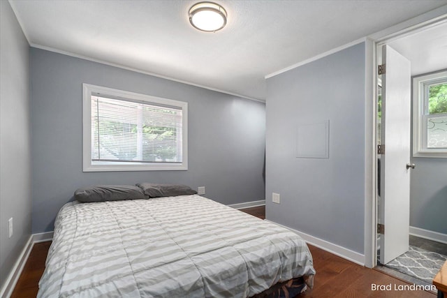 11982 Erica Ln Unit 39, Shelbyville, MI 49344 - bedroom featuring ornamental molding and dark wood finished floors