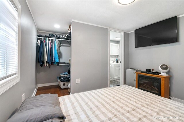 11982 Erica Ln Unit 39, Shelbyville, MI 49344 - bedroom with baseboards and ensuite bath