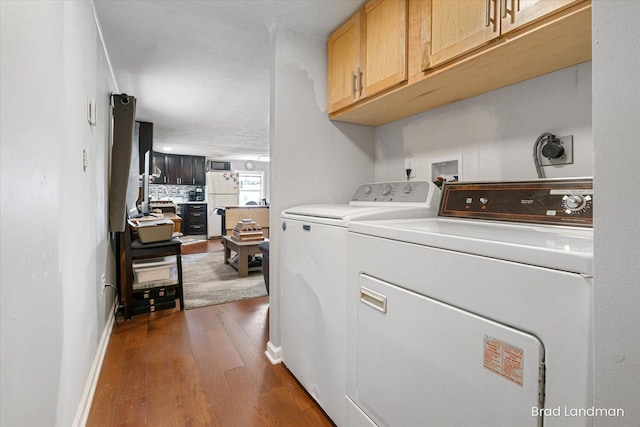 11982 Erica Ln Unit 39, Shelbyville, MI 49344 - washroom with cabinet space, dark wood-type flooring, and washing machine and dryer