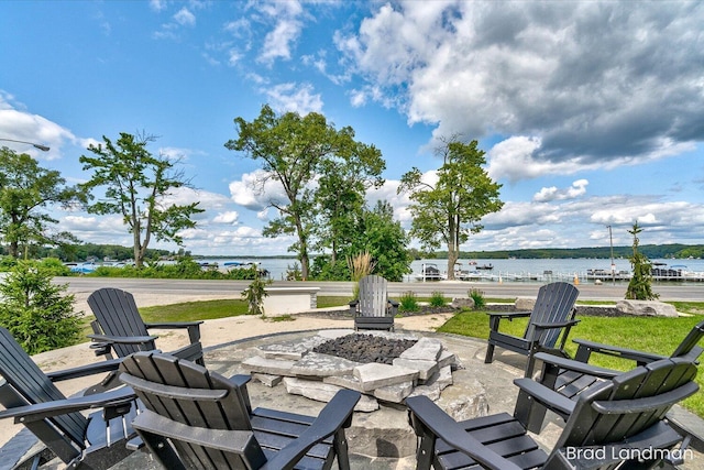11982 Erica Ln Unit 39, Shelbyville, MI 49344 - view of patio featuring an outdoor fire pit and a water view