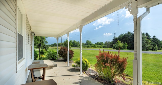 6550 Black River Rd, Croswell, MI 48422 - covered porch with a lawn