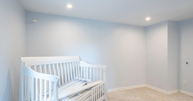 6550 Black River Rd, Croswell, MI 48422 - bedroom featuring light colored carpet, recessed lighting, and a crib