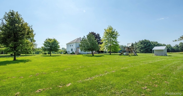 6550 Black River Rd, Croswell, MI 48422 - view of grassy yard with a playground