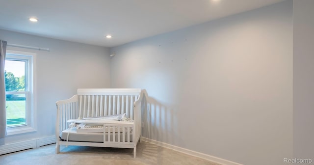 6550 Black River Rd, Croswell, MI 48422 - carpeted bedroom featuring multiple windows, recessed lighting, and a baseboard heating unit