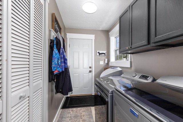 7241 Cherry Ave, Kewadin, MI 49648 - laundry room featuring washing machine and clothes dryer and cabinet space