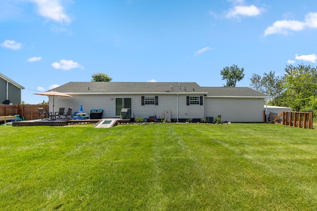 7241 Cherry Ave, Kewadin, MI 49648 - back of property featuring a patio and a shingled roof