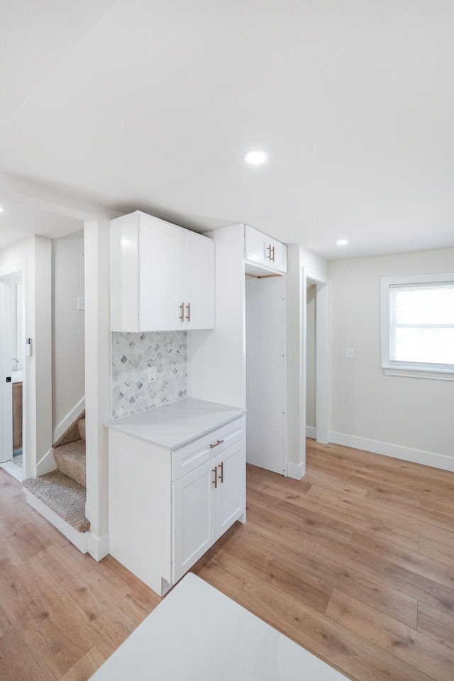 20157 Huntington Ave, Harper Woods, MI 48225 - kitchen featuring light countertops, white cabinetry, light wood-style flooring, backsplash, and recessed lighting