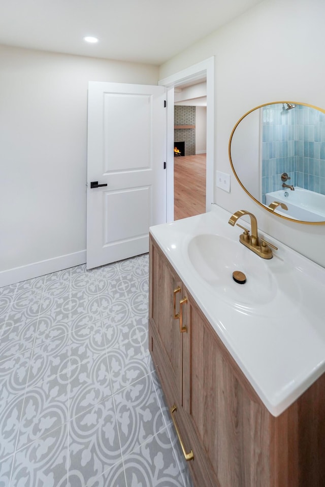 20157 Huntington Ave, Harper Woods, MI 48225 - bathroom with vanity and a lit fireplace
