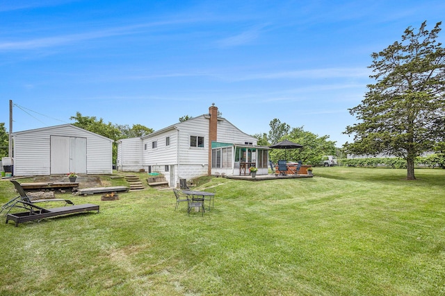 3477 Esson Dr, Grand Blanc, MI 48439 - view of grassy yard with a shed and a patio