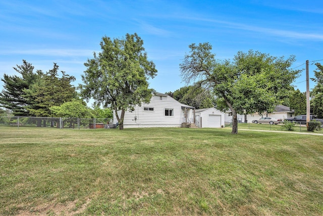 3477 Esson Dr, Grand Blanc, MI 48439 - view of yard with entry steps, a detached garage, and an outdoor structure