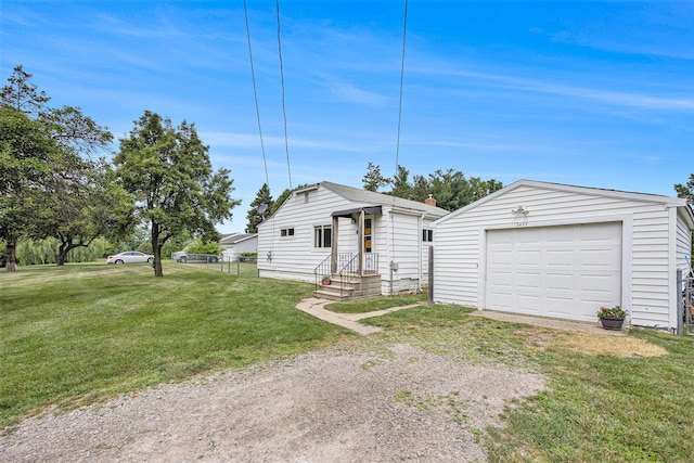 3477 Esson Dr, Grand Blanc, MI 48439 - view of front of property with an outbuilding, a detached garage, and driveway