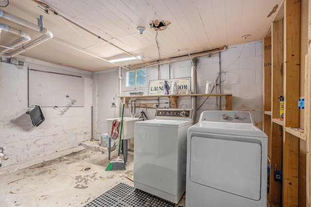 3477 Esson Dr, Grand Blanc, MI 48439 - washroom with independent washer and dryer and concrete block wall