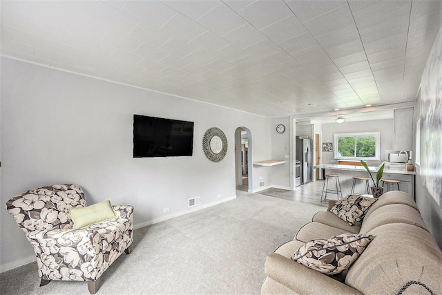 3477 Esson Dr, Grand Blanc, MI 48439 - living area featuring arched walkways and light carpet