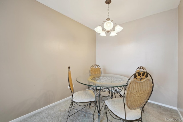 8200 E Jefferson # 1202, Detroit, MI 48214 - carpeted dining area featuring a chandelier and baseboards