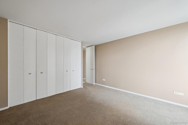 8200 E Jefferson # 1202, Detroit, MI 48214 - unfurnished bedroom featuring carpet flooring and a closet