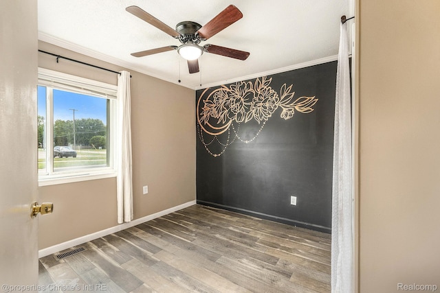 58 Yeamans St, Mount Clemens, MI 48043 - unfurnished room featuring wood finished floors, crown molding, and ceiling fan