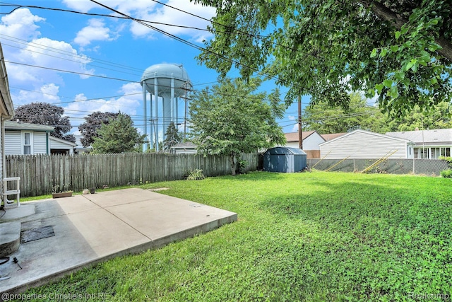 58 Yeamans St, Mount Clemens, MI 48043 - fenced backyard featuring a patio and a storage shed