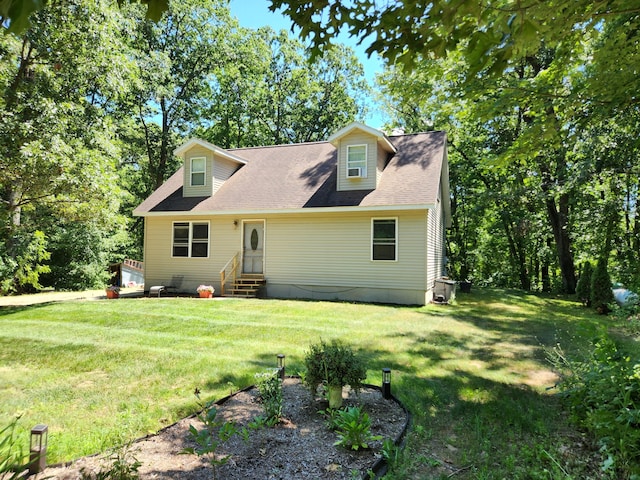 23967 Derek Dr, Sand Lake, MI 49343 - cape cod house featuring entry steps and a front lawn