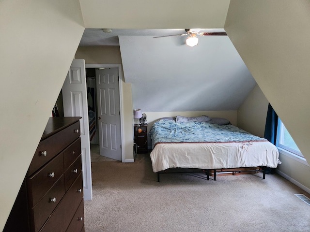 23967 Derek Dr, Sand Lake, MI 49343 - carpeted bedroom with a ceiling fan and vaulted ceiling