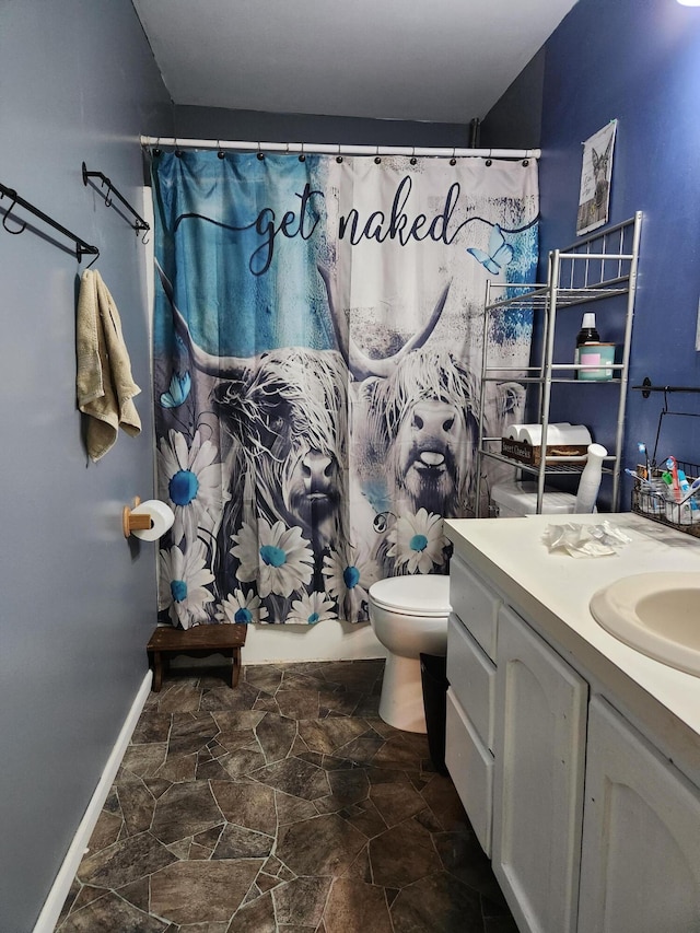 23967 Derek Dr, Sand Lake, MI 49343 - bathroom featuring vanity and stone finish floors