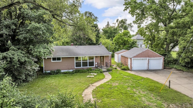 1196 S Dettman Rd, Jackson, MI 49203 - view of front of property featuring a garage, an outdoor structure, a front lawn, a chimney, and roof with shingles
