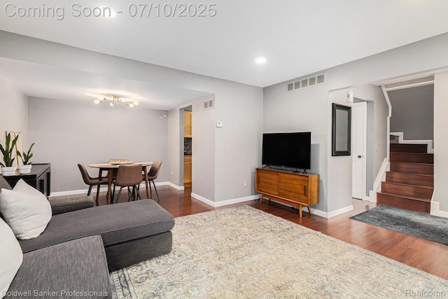 42173 Pellston Dr, Northville, MI 48167 - living area with stairway, dark wood-style floors, recessed lighting, and a chandelier
