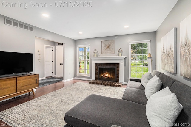 42173 Pellston Dr, Northville, MI 48167 - living room with wood finished floors, a brick fireplace, and recessed lighting