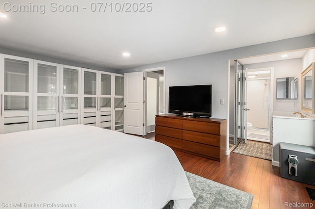 42173 Pellston Dr, Northville, MI 48167 - bedroom with recessed lighting, dark wood finished floors, and ensuite bath