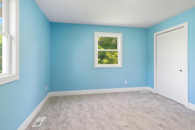 6750 Walters Rd, Clarkston, MI 48346 - unfurnished bedroom with carpet and a closet