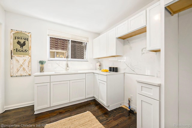 18661 Stoepel St, Detroit, MI 48221 - kitchen with dark wood finished floors, light countertops, and white cabinets