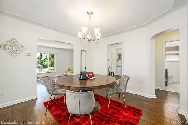 18661 Stoepel St, Detroit, MI 48221 - dining area featuring arched walkways, wood finished floors, and a chandelier
