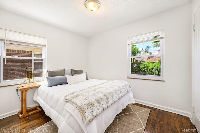 18661 Stoepel St, Detroit, MI 48221 - bedroom featuring baseboards and wood finished floors