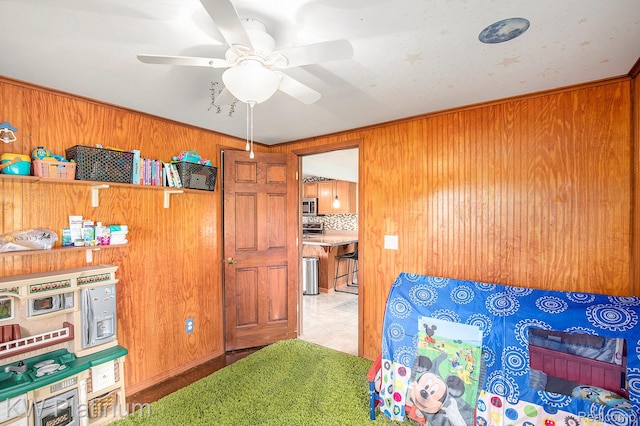 1509 Allen Rd, Kimball, MI 48074 - bedroom featuring wood walls and ceiling fan