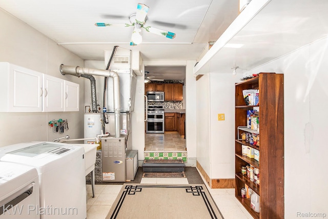 1509 Allen Rd, Kimball, MI 48074 - laundry area with cabinet space, separate washer and dryer, a ceiling fan, and light tile patterned floors